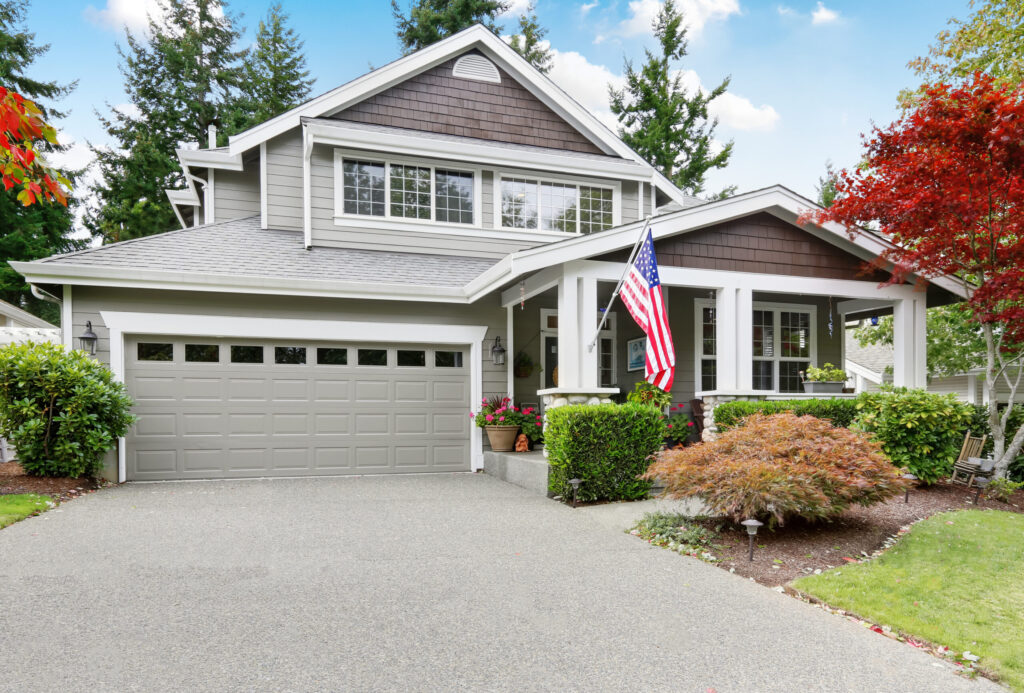 Nice curb appeal of grey house with covered porch